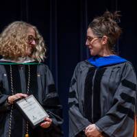 Provost Drake giving Megan Woller-Skar her award